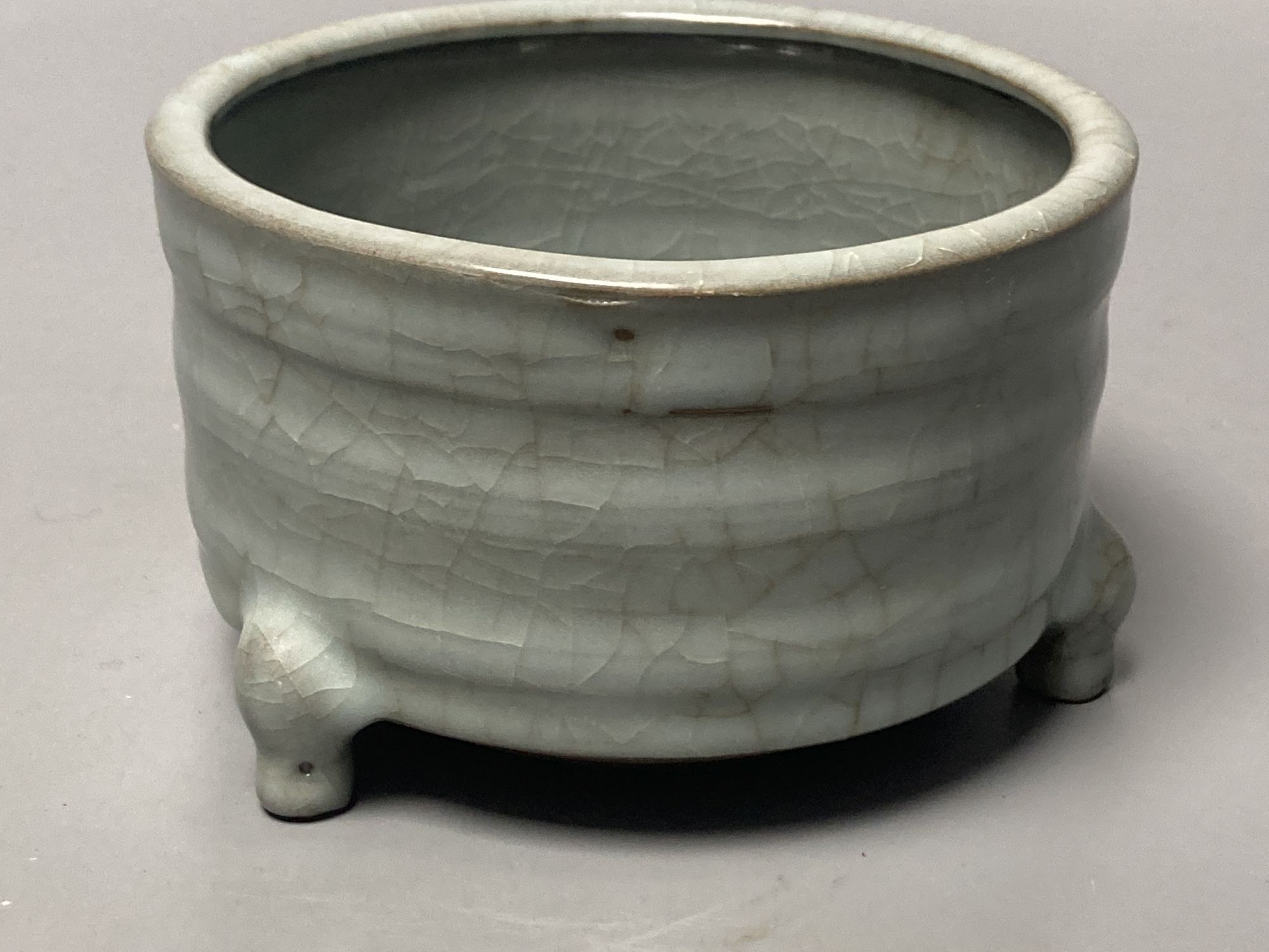 A Chinese celadon cylindrical censer, diameter 13cm